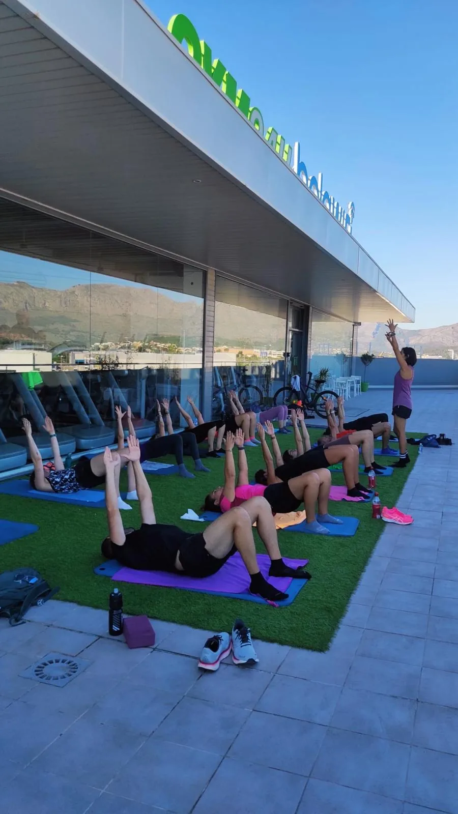 Group class training outside on the Fit Express 24 terrace